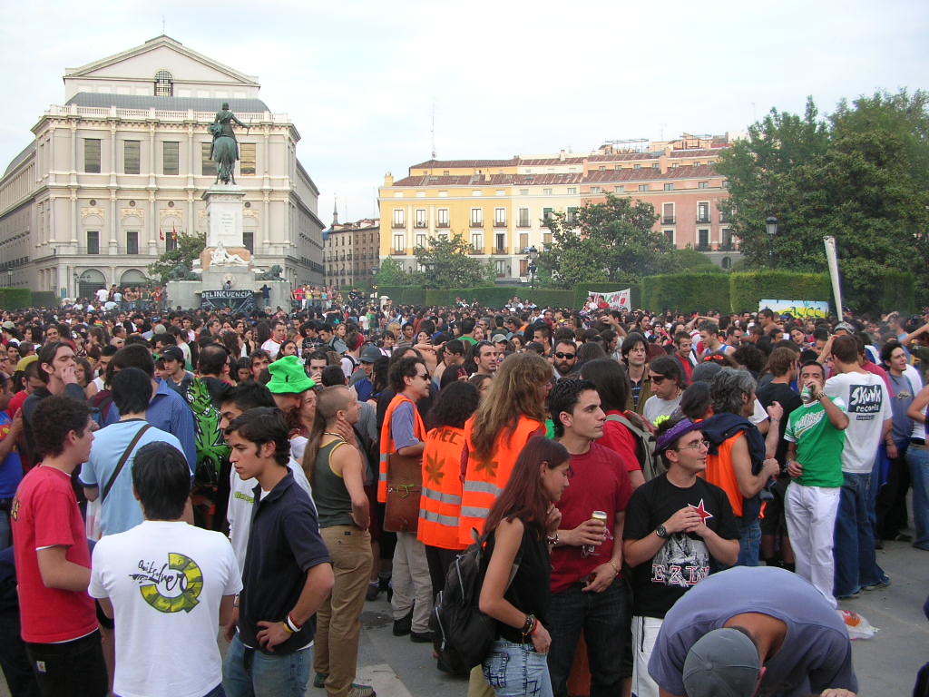 Crowd gathered at a cannabis rally in a city square